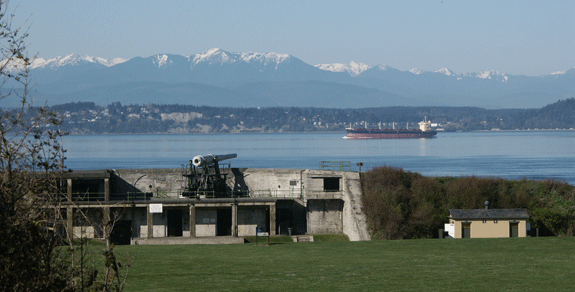 A 10 inch seacoast artillery gun on a disappearing carriage at Fort Casey State Park overlooks the Puget Sound (photo by Steven Kobylk, 2006)